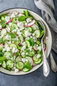 Fresh cucumber radish salad with goat cheese