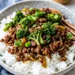 Ground beef and broccoli stir fry served with colorful vegetables