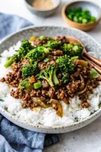 Ground beef and broccoli stir fry served with colorful vegetables